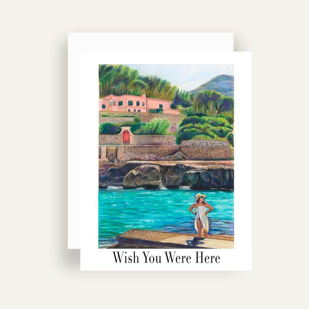 Close up of greeting card with generic text a woman on a beachside landing glazing into the distance