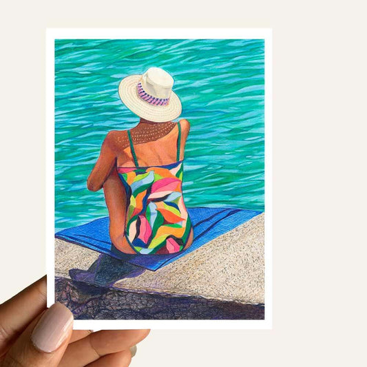 Dreamy Thoughts by the Sea Greeting Card featuring a woman reflecting by the ocean in vibrant colors.