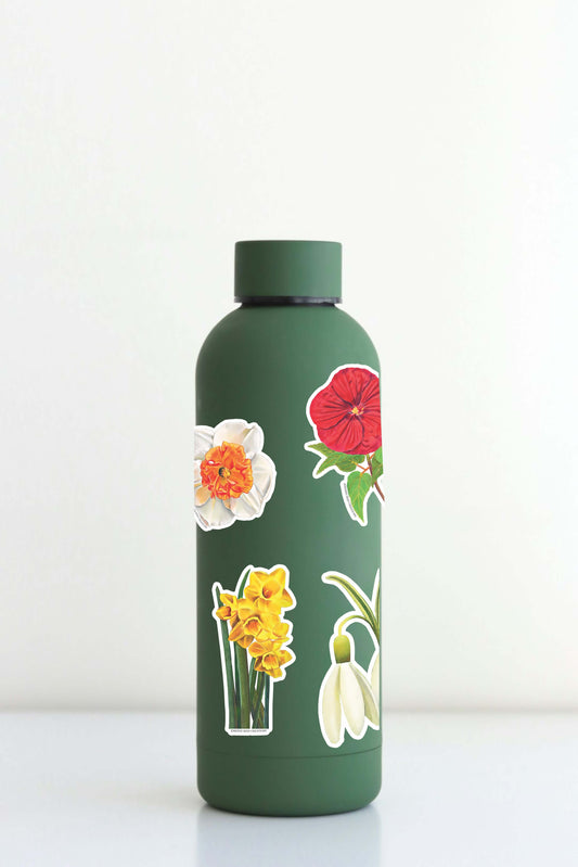 Xtra-Large Flower Sticker Sheet on a green water bottle with floral designs like Snowdrop and Red Poppy.