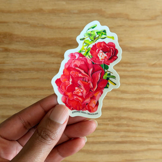 Hand holding a Pink Rose with Leaves Flower on a wooden surface
