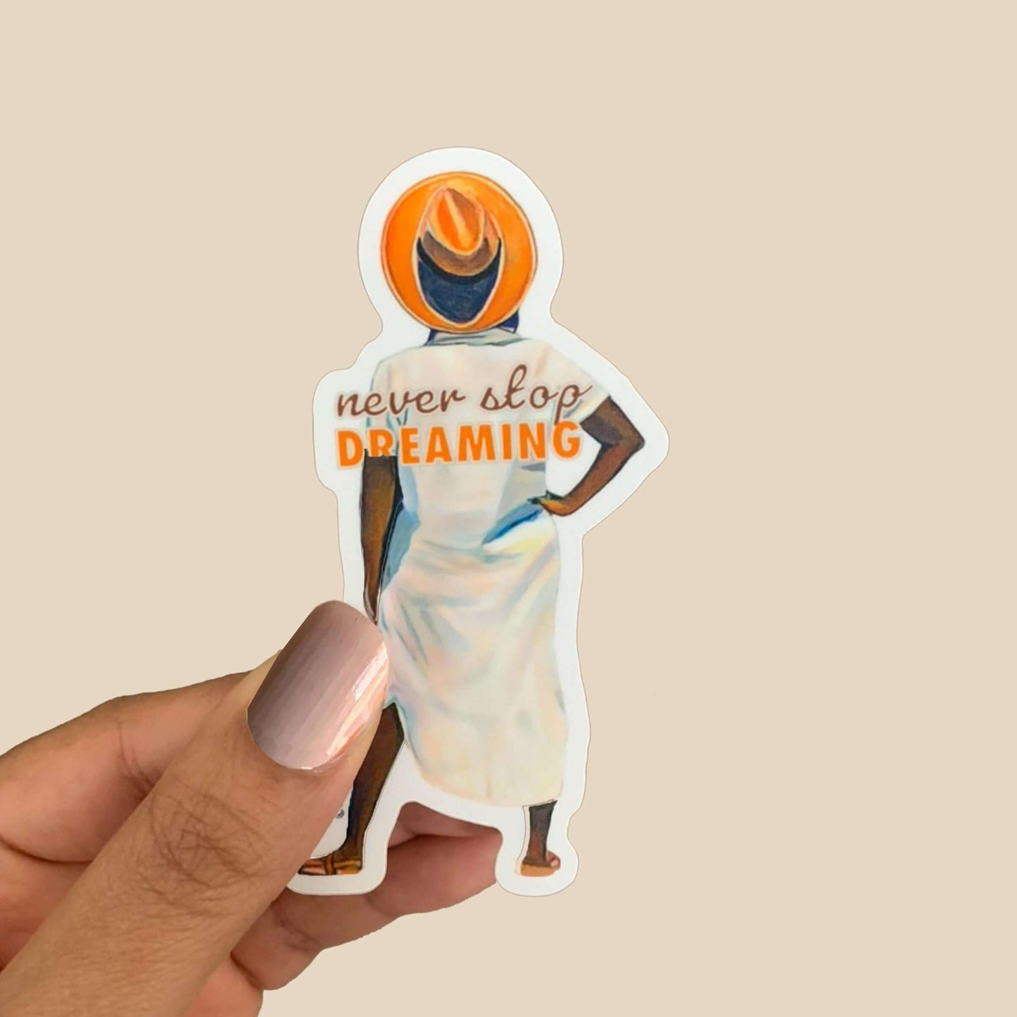 Vinyl sticker of a woman from Renee Reid's Original Artwork Sunkissed with the saying "Never Stop Dreaming" in hand