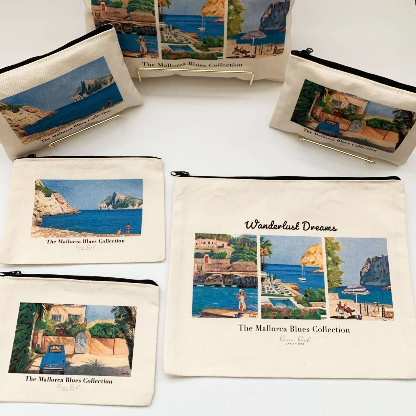 Collage of Mallorca Blues canvas pouches with original art, black zipper, perfect for makeup or toiletries in two sizes, travel-size and small.