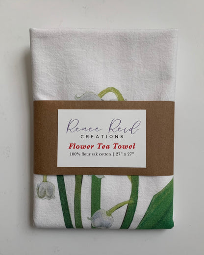 Lily of the Valley Floral Cotton Tea Towel wrapped, featuring Renee Reid's floral artwork on 100% flour sack cotton.