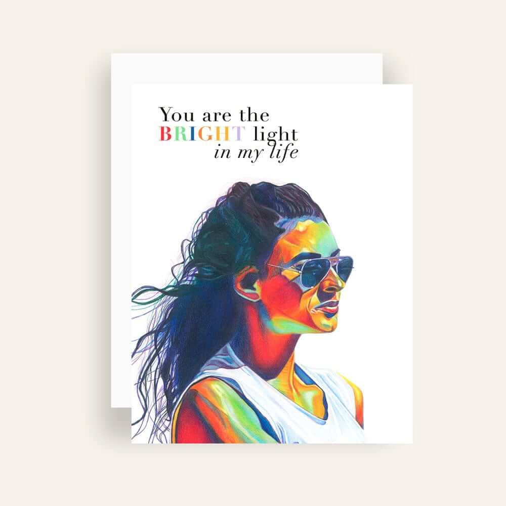 Close up of greeting card with generic text and art of a colorful portrait of a pensive look wearing sunglasses peering into the distance