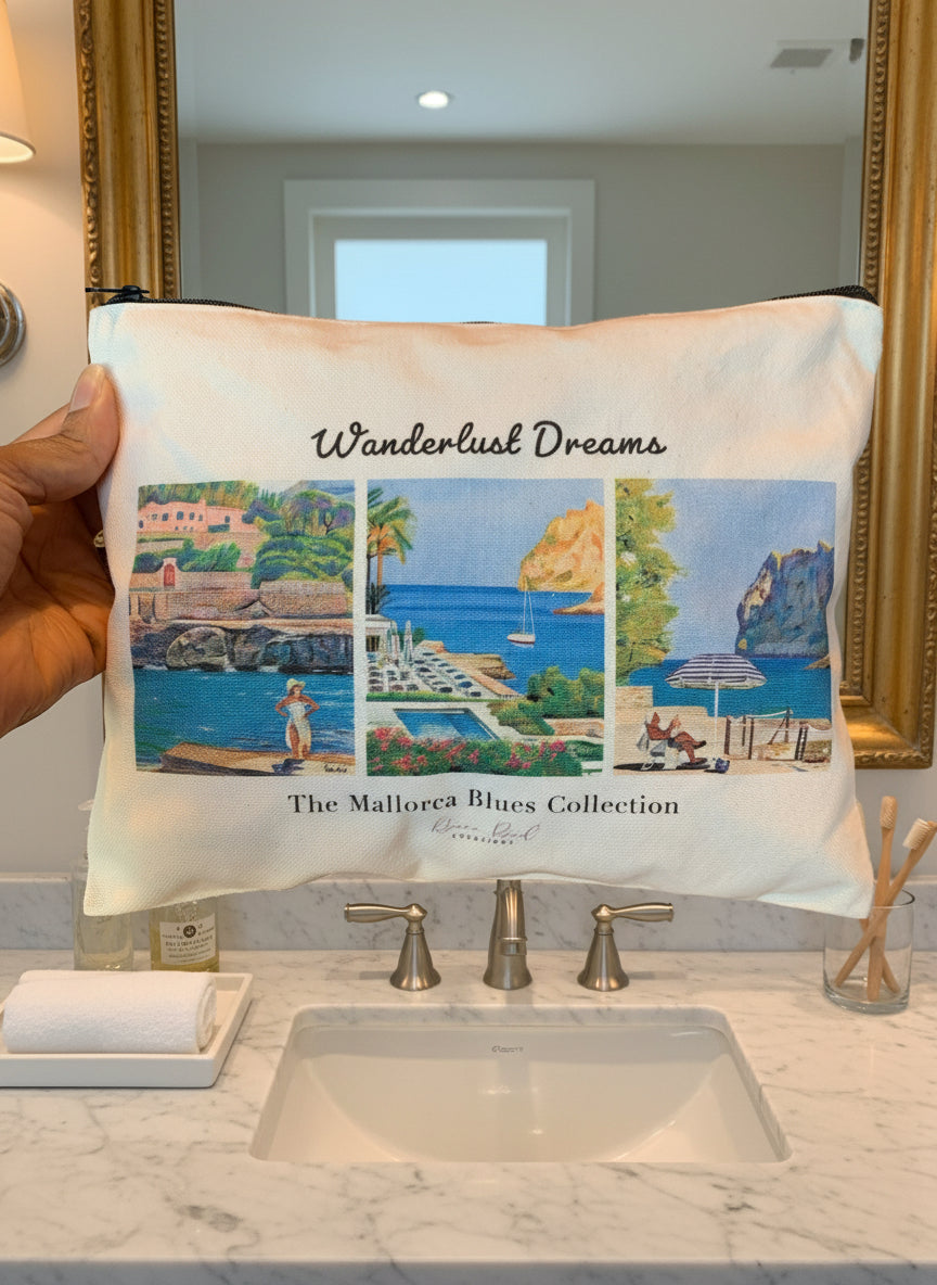 Travel pouch with 'Wanderlust Dreams' and 'The Mallorcan Blues Collection' text held by a person.