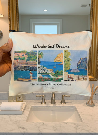 Travel pouch with 'Wanderlust Dreams' and 'The Mallorcan Blues Collection' text held by a person.
