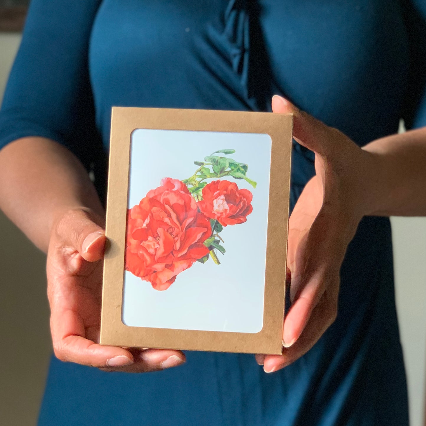 Person holding a Floral Greeting Card Boxed Set featuring a floral design.