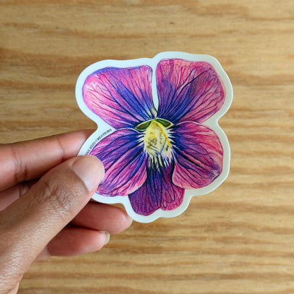 Purple Violet Flower Vinyl Sticker held in hand, featuring detailed pink and purple flower design.
