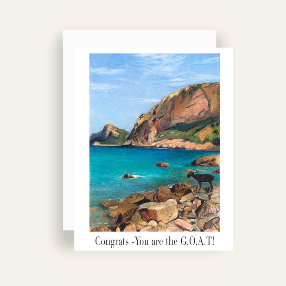 Close up of greeting card with generic text and art of a goat on a rocky seaside beach with cliffs in the background 