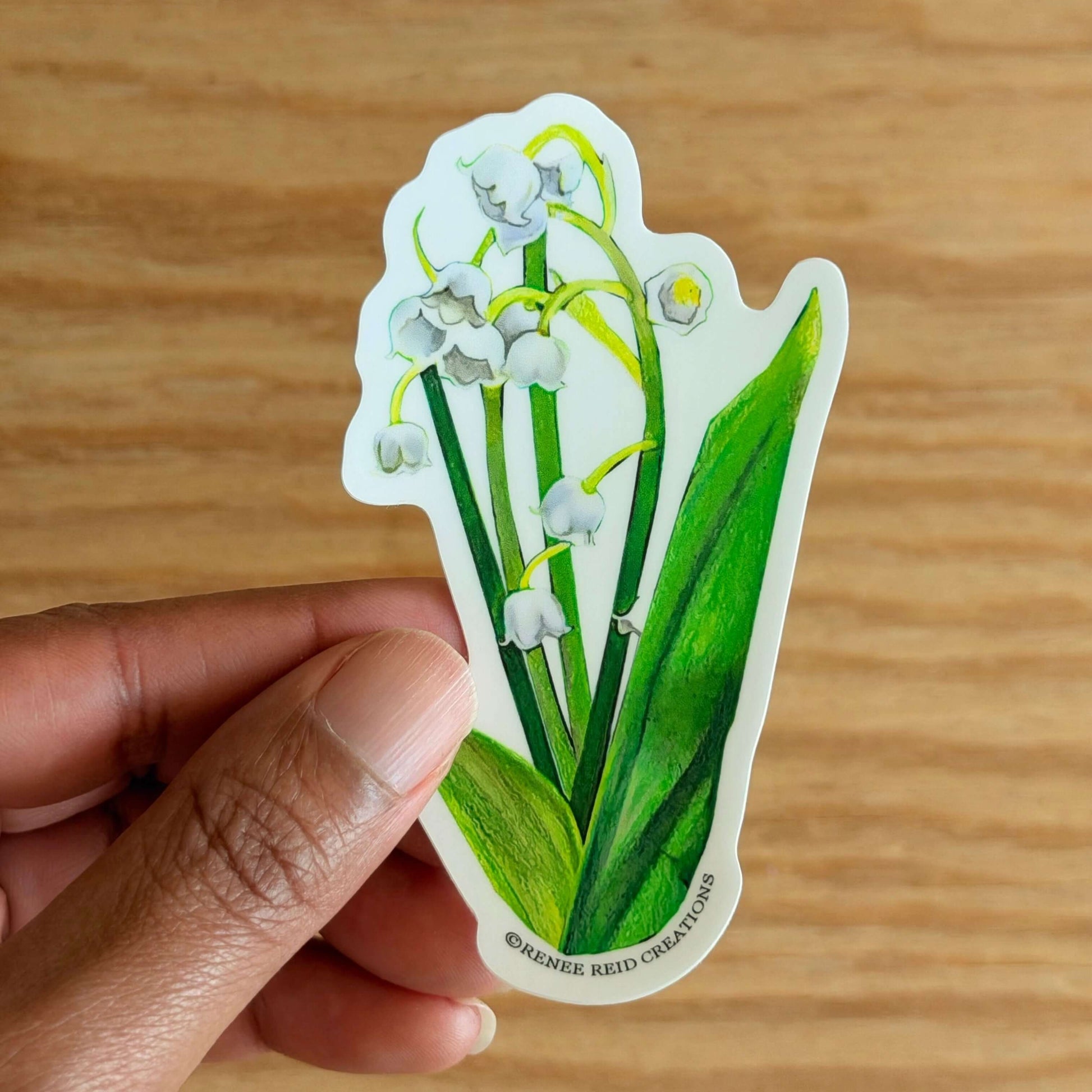 Lily of the Valley Flower Vinyl Sticker on a wooden surface
