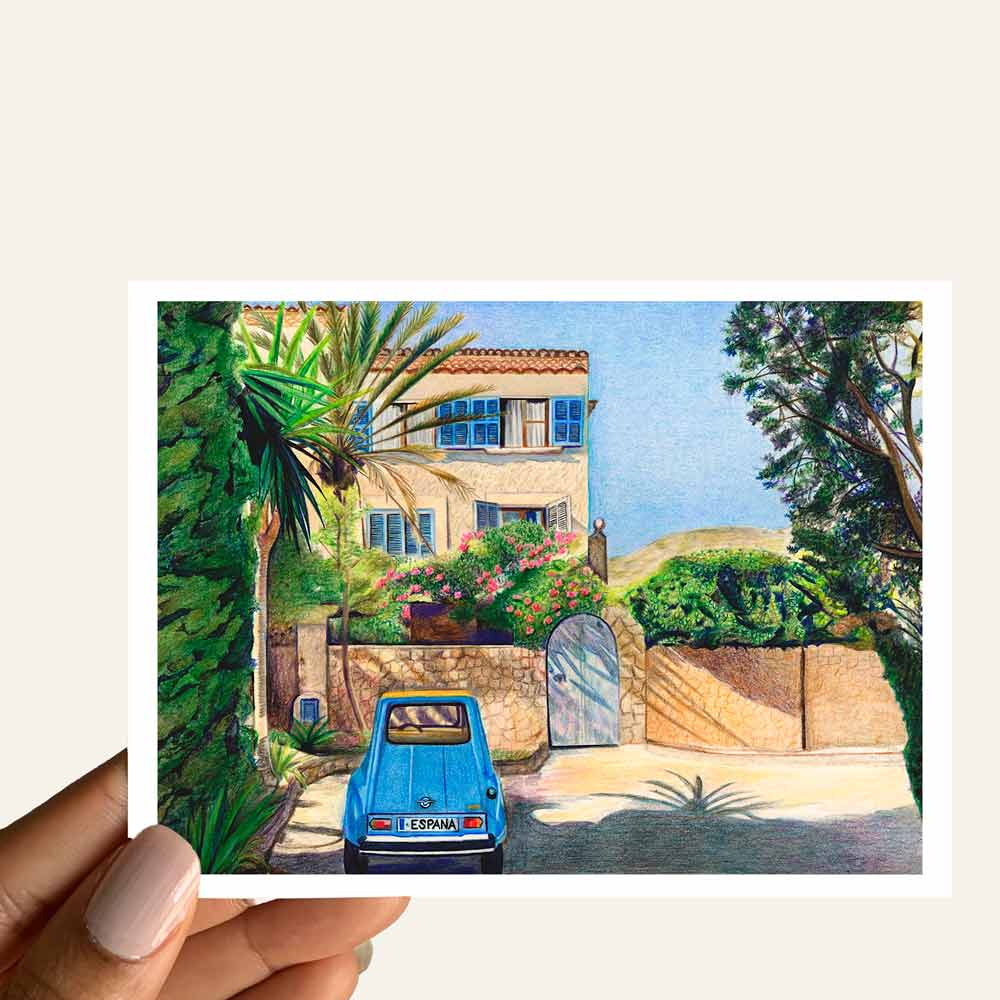 Close up of greeting card of a country home surrounding by trees with a parked blue car in front