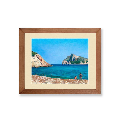 Renee Reid wood framed art print of a beach drawing that has a woman, a man,  rocky beach, blue sky and cliffs 