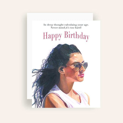 Close up of greeting card with generic text and art of a woman with a pensive look wearing sunglasses peering into the distance