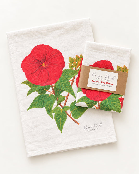 Red Hibiscus Floral Cotton Tea Towel  by Renee Reid Creations flat lay with a white backgound 