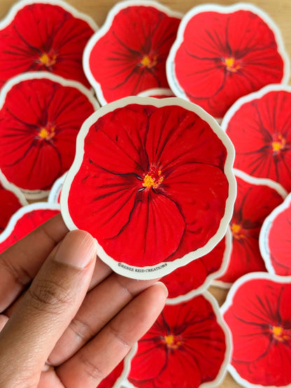 Red Hibiscus Flower Stickers with a hand holding one of them.
