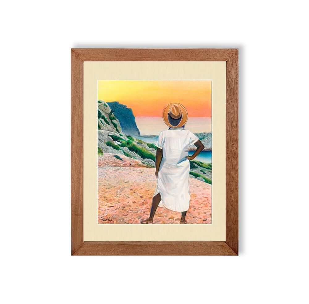 Renee Reid framed art print of a woman gazing into the horizon at a colorful sunset 