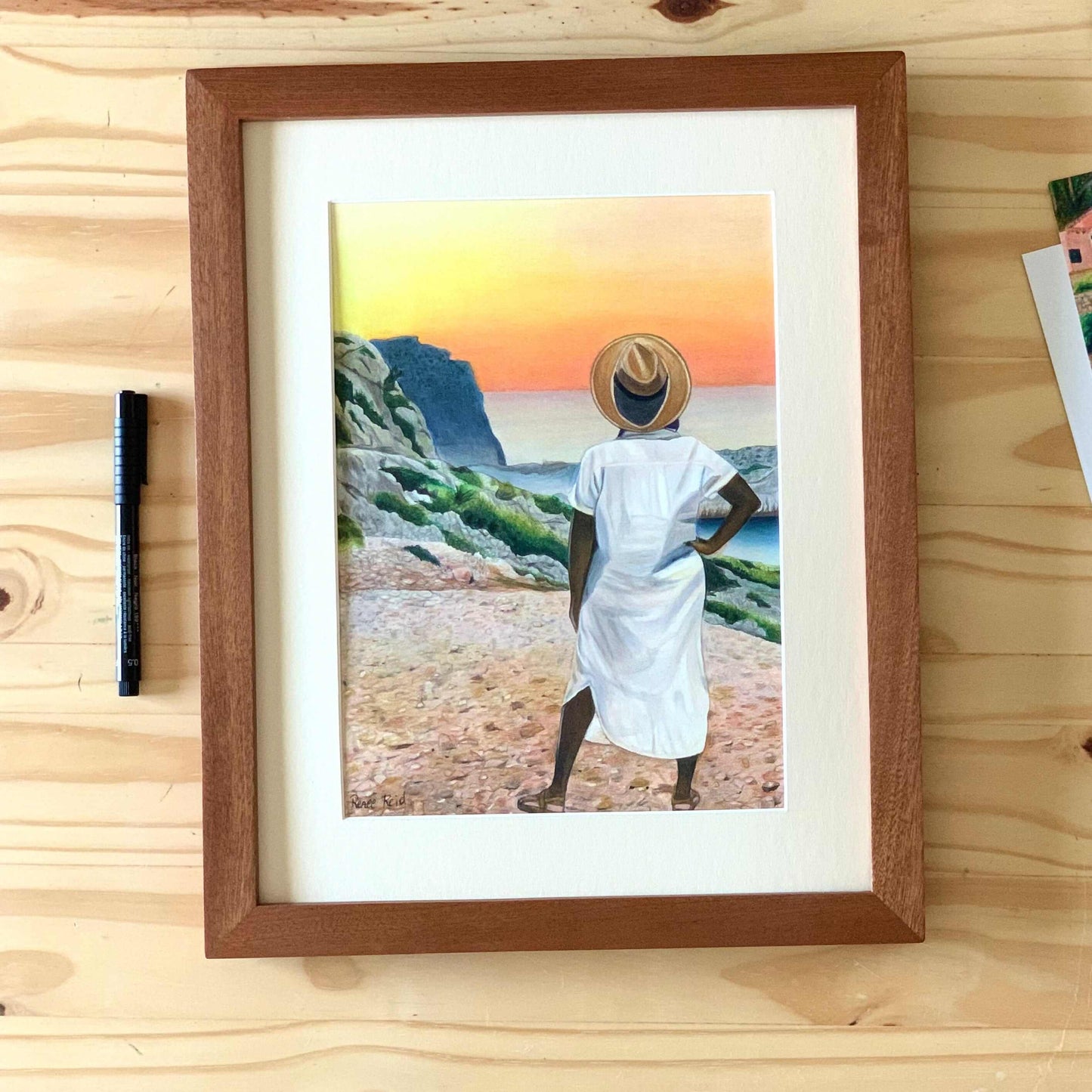 Renee Reid framed original art of a woman gazing into the horizon at a colorful sunset 