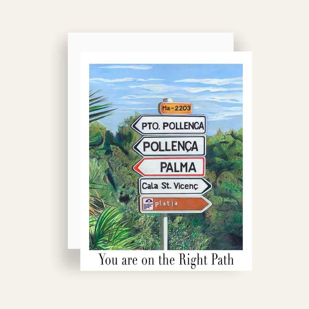 Close up of greeting card with generic text and art of a road sign in Mallorca surrounded by green bushes 