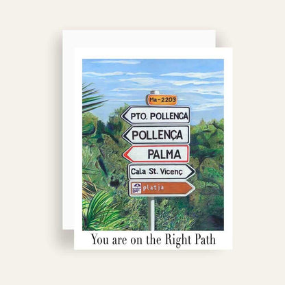 Close up of greeting card with generic text and art of a road sign in Mallorca surrounded by green bushes 