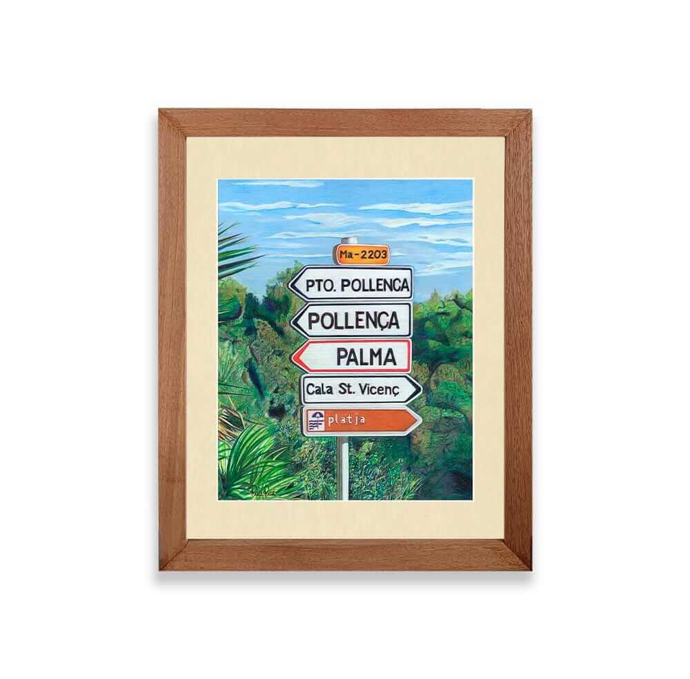 Renee Reid framed art print of a road sign in Mallorca surrounded by green bushes 