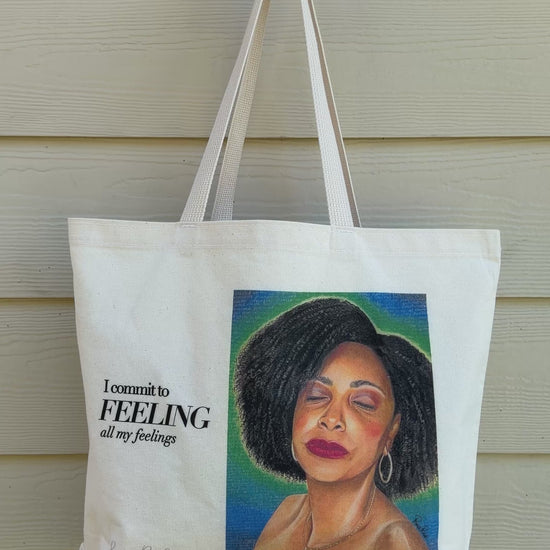 FEELING artist-designed canvas tote bag shown in motion